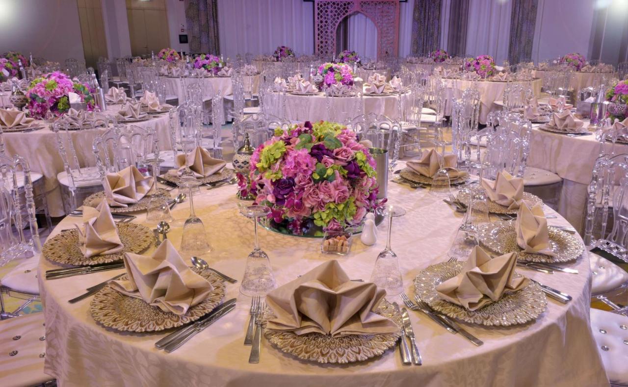 Symphony Style Hotel Kuwait Salmiya Esterno foto A table set for a formal dinner